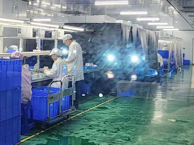 Topleo QC inspection station with quality control staff checking Android TV boxes
